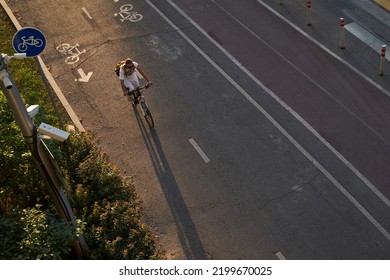 Man Bicycling On Cycling Road. Top Aerial View.