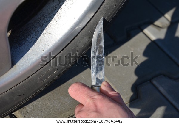 man with a big hunting knife in the parking lot is\
about to stab, cut the tire. revenge to a neighbor, her mistress\'s\
husband, for poor parking at the entrance, envy of a nice car,\
terrorist attack