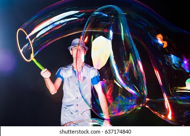 Man with big soap  bubbles