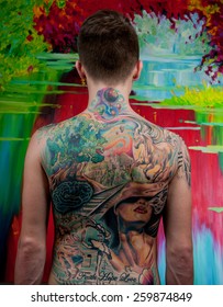 Man With A Big Tattoo On Her Back