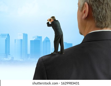 Man With Binoculars Looking Forward Standing On The Shoulders Of Giants Concept With Cityscape Representing Benefitting From Previous Work By Past People, Stock Market Forecasting, Progress & Success.