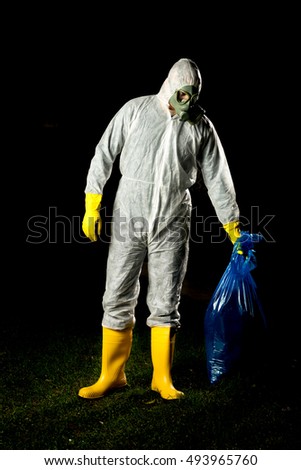 man in bio hazard protective suit with gas mask and gloves