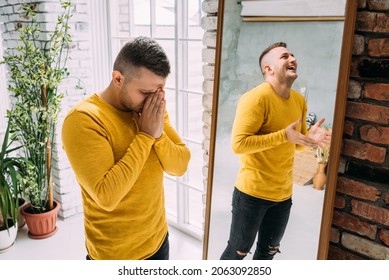 A man with bipolar disorder at the mirror. Bipolar affective disorder. A person with manic-depressive psychosis. Mental illness. A person with depression. A man is reflected in the mirror - Shutterstock ID 2063092850