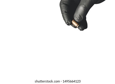 Man in black gloves holding bullets isolated on white background. Illegal drug selling. Criminal problems. Killer.