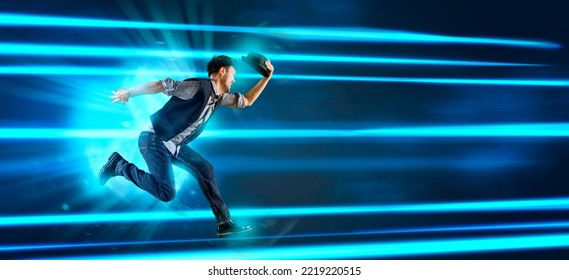 Man With Black Hat Dancing On Blue Neon Background. Contemporary Ballet