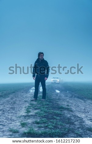 Similar – silhouette of man with poster that puts love