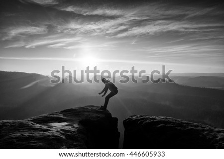 Similar – photographer in mountain at sunset