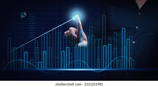 Man In A Black Shirt Stands In Front Of A Holographic Graph With Growing Indicators. Business Growth, Sales Increase. High Performance