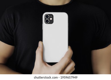 Man In Black Shows The Phone In Case Mockup. 