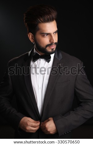 Similar – Young man with lost look in a modern pub.