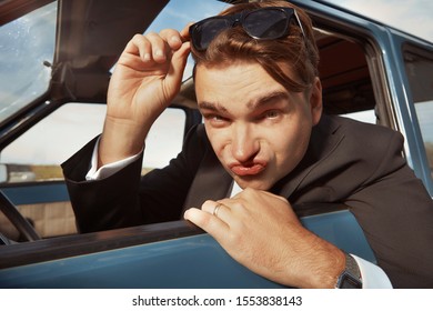 Man In Black Suit Driving His Lovely Retro Car