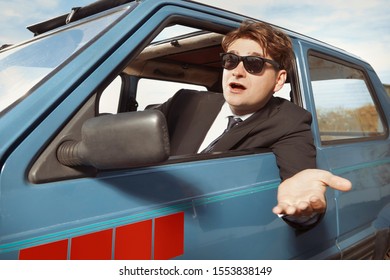 Man In Black Suit Driving His Lovely Retro Car