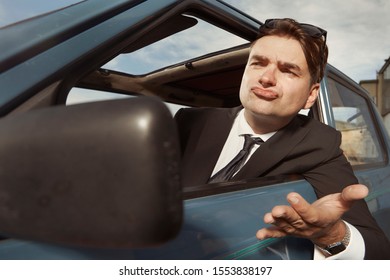 Man In Black Suit Driving His Lovely Retro Car