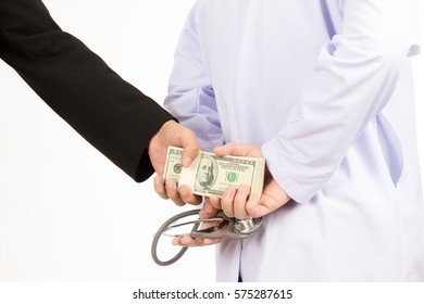 Man In Black Suit Is Given Bribe To Doctor On White Background, Business Concept Corruption In Health Care Industry.