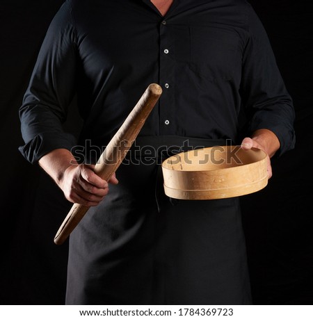 Similar – Image, Stock Photo man sifts white wheat flour through a wooden sieve