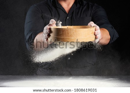 Similar – Image, Stock Photo baked round white wheat bread on a textile towel