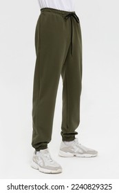 Man in blank green jogger pants mock-up
