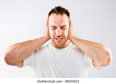 Man Blocking Out Loud Noise From Ears