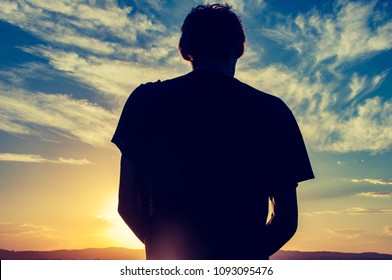 man blocking the sun