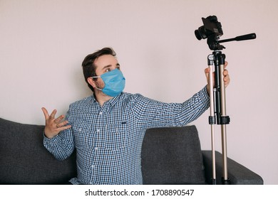 Man Blogger In Medical Mask Talks About Coronavirus. Man Recording Video Blog Tells How To Protect Yourself From 2019-nCov. Blogger Talks Mers-cov How To Use Of Alcohol Wipes, Thermometer