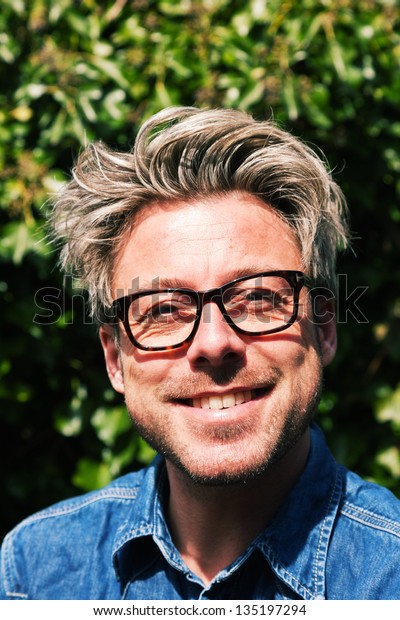 Man Blonde Hair Front Green Foliage Stock Photo Edit Now 135197294