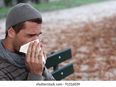 Man Blowing Nose