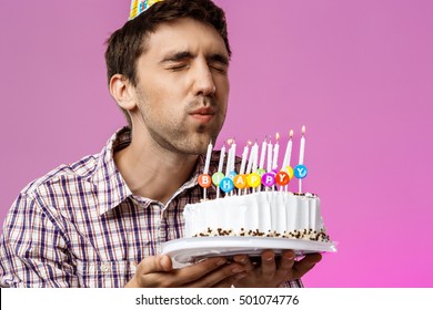 Image result for bearded young man blowing out birthday candles