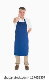 Man In Blue Apron Giving Thumbs Up