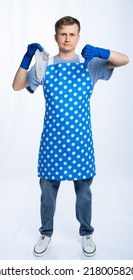 Man In Blue Apron, Rubber Gloves, Blue T-shirt, Jeans. The Homeowner Is Holding A Dirty Sock. White Background.