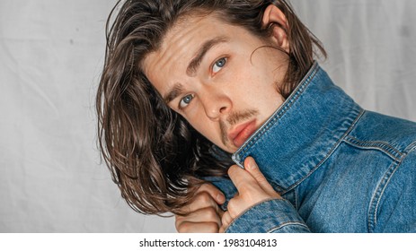 the man in the blue jacket