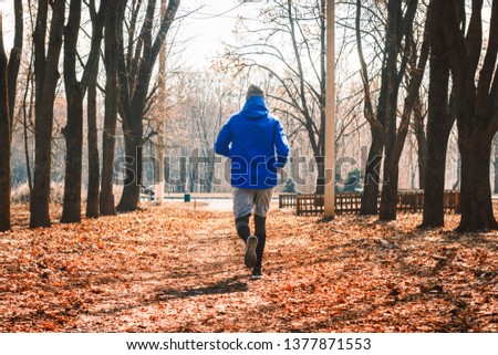 Similar – Young man running outdoors during workout in a forest