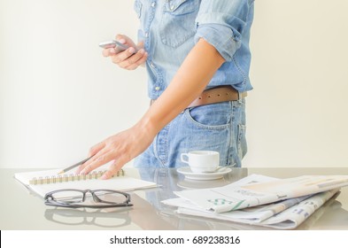 The Man In Blue Jeans Is Using Mobile In Work Time,this Image For Business Concept,soft Focus.