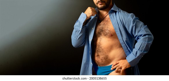 Man With Blue Shirt. Man Body Details With Not Fit Physique. Black Background