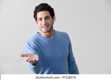 Man In Blue Shirt Giving A Helping Hand