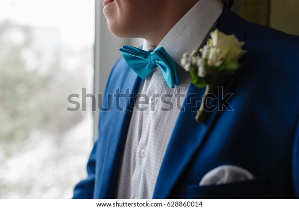 navy suit green bow tie