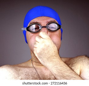 Man With Blue Swimming Cap And Goggles