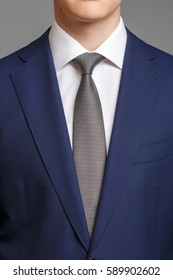 Man In Blue Tuxedo With Grey Tie And White Shirt