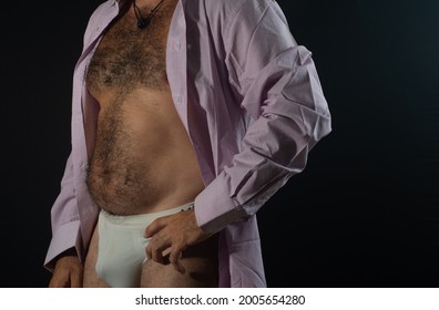 Man Body Detail In Pink Shirt And White Briefs. Man Not Fit. Man Detail With Black Background