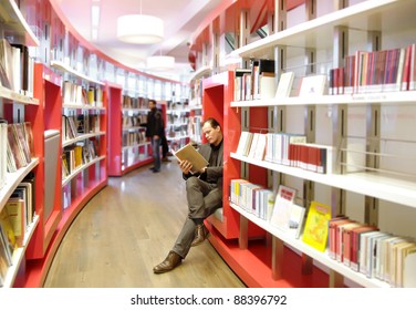 Man In Book Store Reading