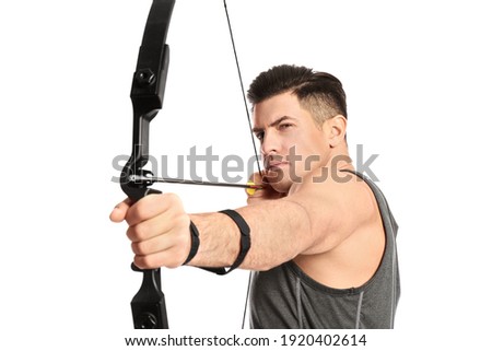 Man with bow and arrow practicing archery on white background