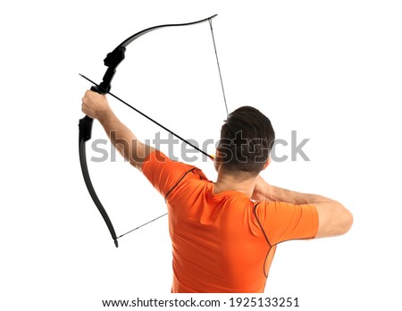 Man with bow and arrow practicing archery on white background, back view