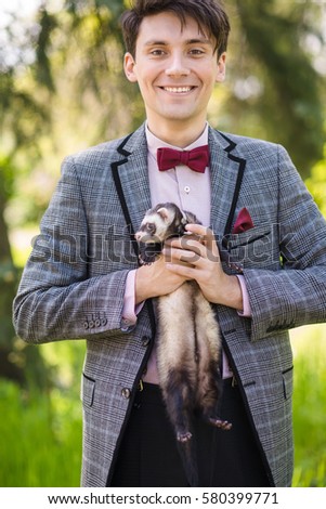 man in bow tie and jacket outdoor