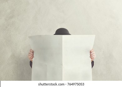 Man With Bowler Holding Empty Newspaper