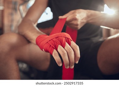 Man, boxer and wrapping gloves with bandage for self defense, fight or workout at indoor gym. Closeup of active male person or fighter with strap on hands or knuckles for boxing safety or protection - Powered by Shutterstock