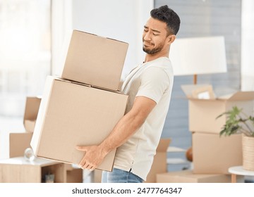 Man, boxes and house moving for property, walking with struggle or heavy cargo in apartment. Male person, carrying and cardboard container in home for real estate, difficult relocation for investment - Powered by Shutterstock