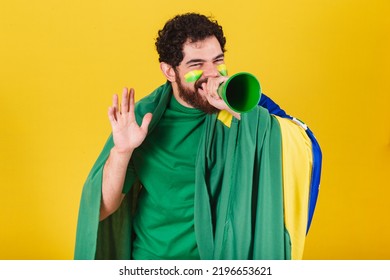 Man, Brazilian, Bearded, Soccer Fan From Brazil, Shouting Promotion With Voice Amplifier. Photo For Advertising, Advertisement And Promotion.