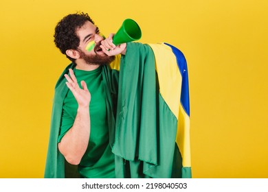 Man, Brazilian, Bearded, Soccer Fan From Brazil, Shouting Promotion With Voice Amplifier. Photo For Advertising, Advertisement And Promotion.