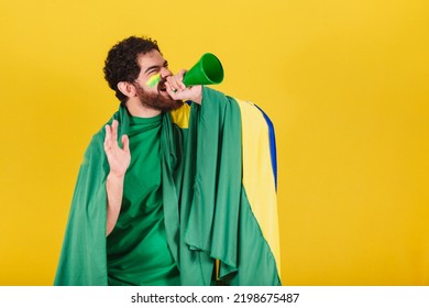 Man, Brazilian, Bearded, Soccer Fan From Brazil, Shouting Promotion With Voice Amplifier. Photo For Advertising, Advertisement And Promotion.