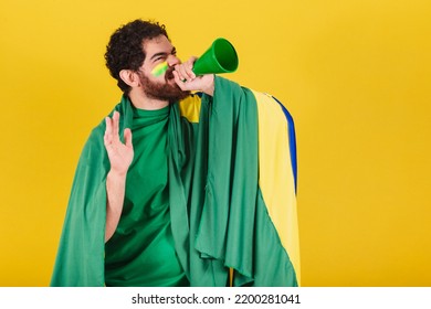 Man, Brazilian, Bearded, Soccer Fan From Brazil, Shouting Promotion With Voice Amplifier. Photo For Advertising, Advertisement And Promotion.