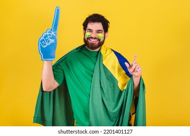 Man, Brazilian, Bearded, Soccer Fan From Brazil, Using Foam Finger Doing Dance Choreography For Team Victory, Goal.